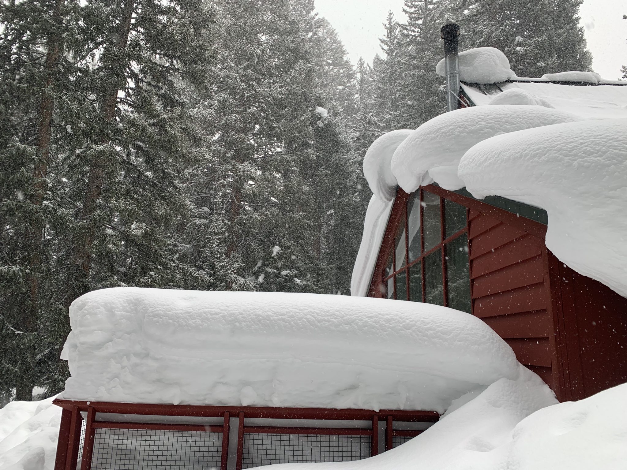 Nearly 15ft of snow resting on Camp Tuttle's iconic lodge back deck