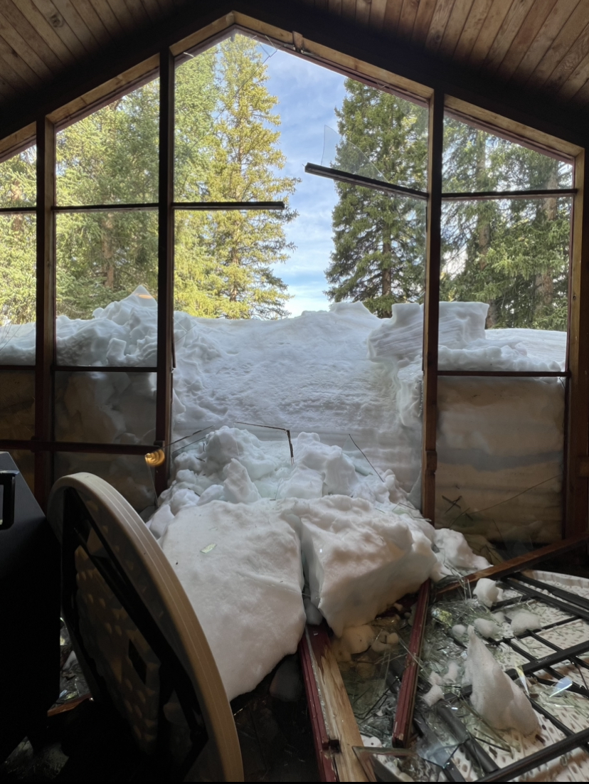 Snow seeps into the lodge after the glass windows shattered